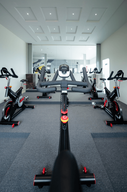 Weightlifting area with barbells and racks.